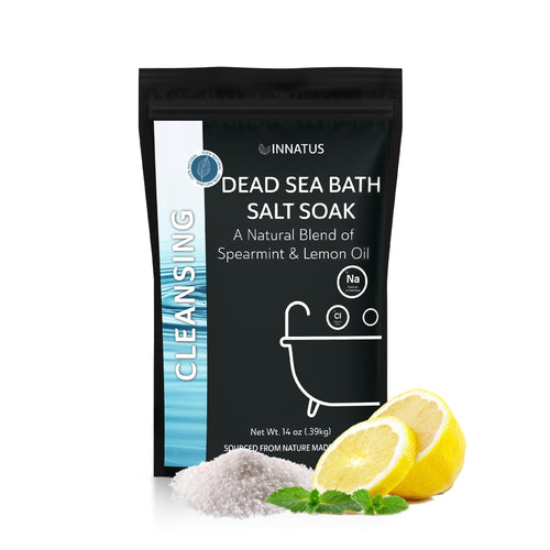 Dead Sea bath salt soak package with lemons and spearmint leaves on a white background